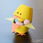 an origami bird with eggs in it's beak