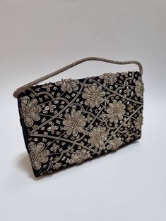 "A beautiful 1950's Zardozi velvet evening bag. Excellent vintage condition. Clean and ready to use. 8\" x 5\" x 2\". Strap: 10.5\". Take a look at our other Zardozi bags for sale :) -------------------- 🌟P&P: 👉Will arrive gift wrapped, in a padded envelope. 👉UK shipping: Free 2nd Class Signed For 👉International Shipping: Tracked & Signed For -------------------- 💎 FOLLOW US:  👉 www.instagram.com/janedreamsofvintage 👉 www.facebook.com/JaneDreamsOfVintage" Black Clutch Evening Bag For Festive Occasions, Embroidered Evening Bag For Festivals, Embellished Evening Clutch For Festivals, Traditional Black Pouch Clutch, Traditional Black Clutch With Handwork, Traditional Black Shoulder Bag For Formal Occasions, Traditional Black Formal Shoulder Bag, Rectangular Evening Bag For Festivals, Formal Pouch Evening Bag With Zari Work