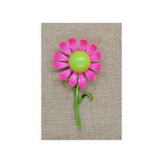 Vintage mod 60s hot pink and green daisy brooch. Unsigned. Has bar style pin on backside. Dimensions: 3.75" x 2" Some paint loss to the backside. Good pre-owned condition. Green Spring Brooches As Gifts, Spring Green Brooch Gift, Green Spring Brooches Perfect As A Gift, Green Spring Gift Brooches, Pink Flower Brooch Pins, Pink Flower Enamel Pin, 1980s Costume, Hot Pink And Green, Green Daisy