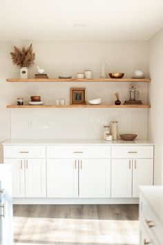 the kitchen is clean and ready for us to use it's shelves are open