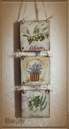 two wall hangings with flowers and plants on them, one has the word olives written in italian