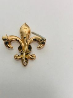 A classic image of the Victorian era ,this beautiful pin/ brooch is a Fleur De Lis in 14k Gold can be worn as a pendant by threading a chain or ribbon through by the small loop at the topor it can be worn as a classic brooch. Condition: Pre-Owned.--Good vintage condition.. Victorian Yellow Gold Jewelry With Screw Back, Collectible Fine Jewelry Brooch, Victorian Gold Pendant Brooches, Victorian Gold Brooch Jewelry, Antique Hallmarked Yellow Gold Brooches, Antique Hallmarked Yellow Gold Brooch, Antique Yellow Gold Hallmarked Brooches, Victorian Yellow Gold Collectible Brooch, Fine Jewelry Brooch For Collectors