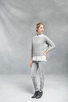 Architectural and completely modern in shape, this cropped pullover is a compelling knit and an eye-catching addition to any wardrobe. The front, back, and sleeves are simple quadrangles worked flat and seamed to achieve a wide, swingy shape with an open neckline and snugly fitted three-quarter-length sleeves. The interplay of twisted ribs, cables, and traveling stitches yields a fabric that wants to move and fold, and clever placement of each element creates flattering lines on the body. Ondawa Textured Knit Long Sleeve Crop Top, Stretch Cropped Sweater With Fine Knit Long Sleeve, Stretch Cropped Sweater With Long Sleeves In Fine Knit, Stretch Long Sleeve Cropped Sweater In Fine Knit, Cropped Knit Sweater For Layering, Elegant Cropped Knit Sweater, Fitted Textured Knit Cropped Sweater, Fine Knit Stretch Cropped Sweater For Fall, Fitted Cable Knit Cropped Sweater For Layering