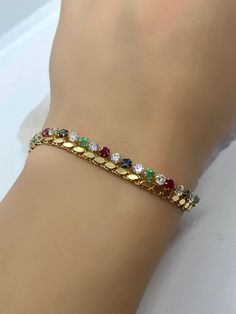 Colorful Bracelet, Gemstone Bracelet, Gold Bracelet, 18k Chain Bracelet, Gold Vintage Jewelry, Jewelry Gift, Emerald, Sapphire, Ruby, Zircon *100% natural gemstone *18k solid gold *solid gold (NOT plated) *gemstone : ruby-sapphire-emerald-zircon *gemstone: 3.00 mm. *stone shape: round *stones emerald: 8 pcs. *stones ruby: 9 pcs. *stones sapphire : 8 pcs. *stone zircon : 25 pcs. *total gemstones : 50 pcs. Yellow Gold Jeweled Round Bracelets, Elegant Multicolor Tennis Jubilee Bracelet, Elegant Multicolor Jubilee Tennis Bracelet, Gold Diamond Multi-stone Bracelets, Gold Diamond Bracelets With Multi-stones, Elegant Yellow Gold Bracelet With Stones, Gold Multi-stone Tennis Bracelet, Gold Cubic Zirconia Multi-stone Bracelets, Yellow Gold Multi-stone Tennis Bracelet As Gift