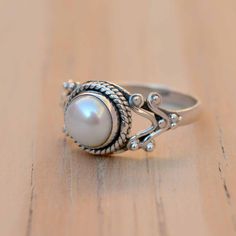 Elegant Stackable Moonstone Ring In Sterling Silver, Elegant Stackable Sterling Silver Moonstone Ring, Classic Sterling Silver Moonstone Wedding Ring, Stackable White Gold Pearl Ring, White Solitaire Open Ring, White Solitaire Open Ring Jewelry, Sterling Silver Moonstone Ring For Wedding, Classic White Flower Promise Ring, Dainty White Crystal Sterling Silver Ring