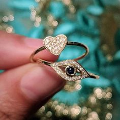 Fun everyday evil eye ring with sapphire and diamonds in 14k yellow gold. Try pairing this ring with some of our other fine or bridge rings. Diamonds (0.06ct) Sapphire (0.08ct) 14k yellow gold Eye is 6x11mm Size 7 Please allow up to 6 weeks for production. Please send us an email if you would like to order this ring in another size. Evil Eye Ring Gold, How To Clean Silver, Gold Heart Ring, Diamond Heart Ring, Spinel Gemstone, Evil Eye Ring, Professional Jewelry, Gold Eyes, Labradorite Ring