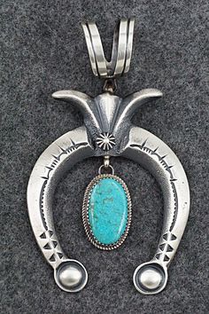 This beautiful turquoise sterling silver naja pendant was made by Navajo silversmith Martha Cayatineto. The back is signed MC and stamped sterling.Length: 3 3/4"Width: 2 1/8"Free shipping on all orders! We ship with USPS and always include tracking. All orders ship within a day of payment.Returns are accepted up to 30 days after you receive your order. Just send us a message. Our shop offers cash back or store credit. The item must be returned in new condition. Silver Southwestern Jewelry With Large Pendant, Hand Forged Silver Turquoise Pendant Necklace, Turquoise Pendant Jewelry With Oxidized Finish, Southwestern Sterling Silver Turquoise Necklace With Large Pendant, Western Style Collectible Turquoise Sterling Silver Necklace, Naja Necklace, Naja Pendant, Navajo Turqoise Necklace, Instagram Jewelry