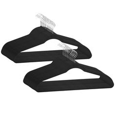 three black plastic hangers on a white background