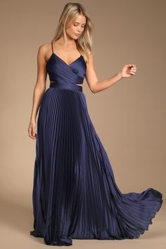 It will be clear just how glamorous you are in the Lulus Got the Glam Navy Blue Pleated Cutout Maxi Dress! Sleek woven satin shapes this dress that has adjustable spaghetti straps, a surplice neckline, and a fitted bodice. A back cutout peeks around to the sides atop a banded waist and an accordion-pleated maxi skirt. Exposed silver zipper on the top and hidden back zipper/clasp on the skirt. Fit: This garment fits true to size. Length: Floor length. Size medium measures 57.5" from adjustable st Navy Blue Maxi Dress, Cutout Maxi Dress, Formal Dresses Gowns, Pleated Maxi Dress, Maxi Dress Formal, Pleated Maxi, Formal Dresses For Women, Lulu Dresses, Maxi Dress Blue