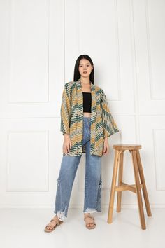 Our Japanese inspired 'Haori Jacket' features a 'parang rusak' motif for effortless and gender neutral styling. ~This is a re-created Haori made with batik fabric. ~Easy to care kimono ~Washable kimono ~To go kimono jacket/outer ~ Pockets WHAT IS HAORI? What is Haori? It's a Kimono jacket that lengths around hip or thigh level with swinging box sleeves, they're shorter than typical Kimono.  Traditionally Haori is a jacket that is worn on top of a Kimono.  Haori can be paired with jeans, shorts, or even long skirts, it's known for an easy look to pair for a Japanese fashion look. SIZE -This will be a gender-neutral item -length is 72cm -Shoulder to shoulder will be 65cm -Sleeve to sleeve length will be 130cm WASH & CARE - It is recommended to wash them inside a net laundry bag with cold tem Traditional Oversized Outerwear For Spring, Cotton Kimono With Natural Dye And Kimono Sleeves, Casual Cotton Kimono With Natural Dye, Cotton Kimono With Batik Print And Long Sleeves, Oversized Cotton Kimono With Open Front, Cotton Open Front Kimono For Fall, Oversized Cotton Open Front Kimono, Fall Cotton Open Front Kimono, Long Sleeve Cotton Kimono With Natural Dye