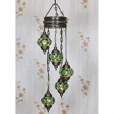 a chandelier with green glass balls hanging from it