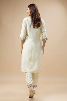 Ivory kurta with anchor thread embroidery in floral pattern on cutwork neckline. Paired with border embroidered pant and dupatta. - Aza Fashions Off White Silk Sets With Floral Embroidery, Elegant Traditional Wear With Embroidered Border In Off White, Elegant Off White Traditional Wear With Embroidered Border, Cream Embroidered Cotton Silk Set, Cream Straight Kurta Set With Floral Embroidery, Off White Floral Embroidered Traditional Wear For Reception, Fitted Off White Kurta With Floral Embroidery, Off White Traditional Wear With Floral Embroidery For Reception, White Silk Sets With Embroidered Border