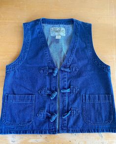 The cutest vintage denim vest with two front square pockets and three large toggle closures  100% cotton  Tag reads size small fits small and medium By Solanza Vintage Denim Vest, Vest Outfits, 90s Vintage, Denim Vest, Vintage Denim, Womens Vest, The Cutest, Size Small, Square