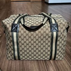 100% Authentic Beautiful Preowned Condition Unisex Handles Drop At 6.5” Exterior Fabric Has No Scuffs Or Stains. Interior Has Signs Of Used Throughout/ Light Stains. Brown Leather Handles Including Trim Has Normal Signs Of Used As Pre-Used/Light Creasing/Light Scratching. Corners Have No Holes. Please Zoom In All Pictures For Details Gucci Duffel Bag Travel, Duffel Bag Travel, Light Stain, Gucci Bags, Leather Handles, Leather Handle, Travel Bag, Travel Bags, Brown Leather