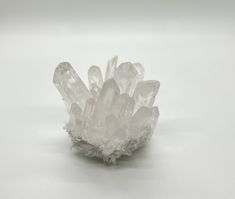 a cluster of crystals sitting on top of a white table