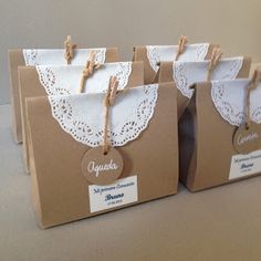 small brown paper bags with white lace on them