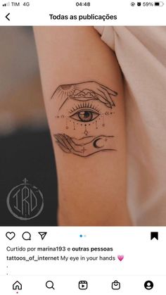 a person with a tattoo on their arm and an eye in the middle of it