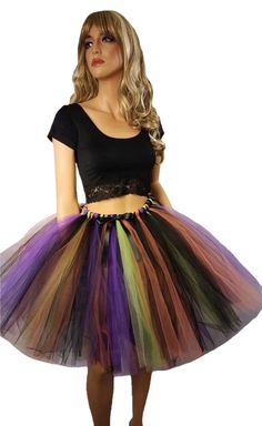 "Create your costume using this fluffy made to order witch tutu skirt. This skirt is made by tying strips of tulle to an elastic band and comes with a decorative satin black bow. The colors are Black, Orange, Purple, and Green Apple. Available in child and adult sizes. Child size 14 through adult sizes will be 20\" in length. Child sizes smaller than a 14 will be around knee length. Please message me before purchasing if you would like the skirt longer. Adults pick your size based on the size ch Cowgirl Tutu, Witch Tutu, Inner Witch, Simple Tank Tops, Fluffy Skirt, Cast A Spell, Chapeau Cowboy, Unique Costumes, Witchy Fashion