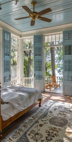 a bedroom with blue shutters and a bed