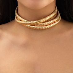 Make an unforgettable statement with this triple layer Water Resistant, semi-stretch ribbed choker. Featuring 7mm width for each layer for an edgy, modern look. One of the layers crosses over for a bold and unique look. Details Material: Gold plated, triple plated, over stainless steel - water resistant/waterproof Size: Approx. 7mm thick each layer Length: Approx. 12" plus a 3" extension (15" total) Closure: Lobster clasp Imported. Thick Choker Necklace, Thick Choker, Layered Crosses, Herringbone Texture, Layered Chokers, Statement Choker, Statement Choker Necklace, Accessories Jewelry Necklace, Herringbone Pattern