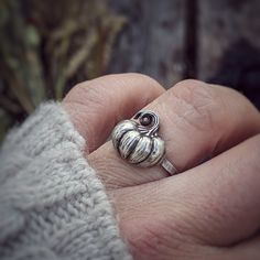 Introducing our stunning Sterling Silver Pumpkin Ring! This enchanting piece exudes all the fall vibes, capturing the spirit of the harvest season. Crafted with meticulous attention to detail, this ring features a delicate pumpkin design that is both whimsical and witchy. Perfect for embracing the Halloween spirit, it adds a touch of magic to any outfit. Made with .925 sterling silver, this unique piece of jewelry is sure to be a statement accessory that will be cherished for years to come. Embr Nature Wedding Band, Pumpkin Ring, Nature Wedding Ring, Moon Goddess Necklace, Pumpkin Jewelry, Silver Pumpkins, Pink Heart Necklace, Nature Inspired Rings, Wiccan Jewelry