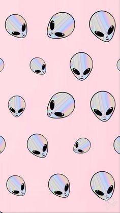 an alien pattern is shown on a pink background with black and white dots in the middle