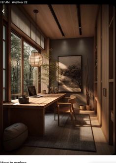 an image of a home office setting with wood paneling and large windows overlooking the woods