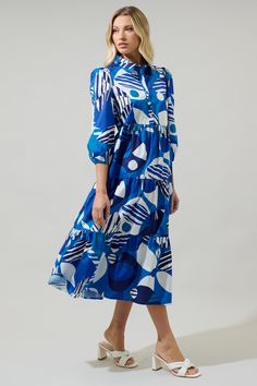 There's nothing cuter than the Beatty Geometric Button Up Midi Dress as it showcases a charming geometric motif. It features a collared neck followed by long sleeves and a button up front. The bottom has layers of tiers giving it that fresh look. Style it with any heels. - Button up- Balloon sleeves- Tiered- Midi- Color: Blue ComboSize + Fit - Model is 5'8" and wearing size XS- Measurements taken from size S - Chest: 19"- Length: 48 1/2" Fabric Self:100%Cotton Style Number STD14460P Blue Long Sleeve Midi Dress With Abstract Print, Camisole Bra, Wrap Jumpsuit, Geometric Motif, Bra Dress, Body Dress, Fresh Look, Curve Dresses, Blue Midi Dress