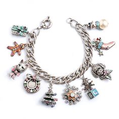 "Ten charms convey sweet memories of Christmas past. Each charm is a dimensional, miniature sculpture, conceived in the lost wax process before conversion to a pewter mold. Exceptional detail is found in everything, from the eyes of the shaggy dog to the fur of the Christmas cat to the carrot nose on the pearl snowman. Behind the jeweled wreath is a locket. The theme, color and jingle of the bracelet are joyous, like the words to a Christmas carol or the images on a 1950s greeting card. The silv Collectible Silver Christmas Jewelry, Silver Charm Bracelet For Christmas, Nickel-free Metal Christmas Jewelry, Silver Holiday Bracelet, Silver Bracelets For Holiday, Silver Bracelet For Holiday, Silver Metal Jewelry For Holidays, Silver Charm Bracelets For Christmas, Romance Christmas