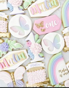 some decorated cookies are laying on a white counter top with the words welcome one above them