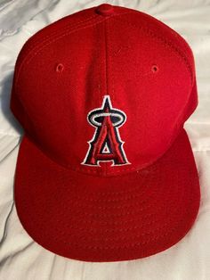 Selling is a new 59Fifty, Los Angeles Angels size 8 fitted red baseball cap.  Please see photographs provided for more information for this product.  The stock number for this product is 1046-0919-005 Red Fitted Cap For Baseball Season, Red Sports Flat Cap, Red Flat Cap For Sports, Red Flat Brim Baseball Cap For Sports Events, Classic Red Baseball Cap With Flat Brim, Red Flat Cap For Baseball Season, Red Flat Bill Fitted Hat For Baseball Season, Red Fitted Hat For Baseball Season Streetwear, Red Snapback Flat Cap For Sports