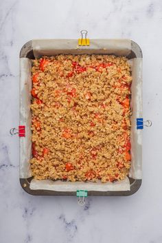 an uncooked casserole dish on a marble surface