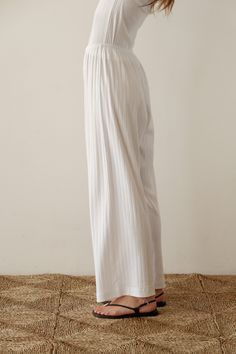 Our best-selling simple pant reimagined in a cropped silhouette. The Pointelle Simple Crop Pant is super-soft, effortless and versatile. Pairs perfectly with The Pointelle Sqaure Neck Tank and The Pointelle Baby Tee Made in LA Wide-leg Pants With Elastic Waistband For Daywear, White Wide Leg Harem Pants For Loungewear, Spring Wide Leg Culottes With Elastic Waistband, Spring Wide-leg Culottes With Elastic Waistband, Chic Wide Leg Trousers For Loungewear, Chic Wide Leg Loungewear Trousers, Chic Loungewear Wide Leg Trousers, Wide Leg Cotton Bottoms For Daywear, High Waist Culottes With Elastic Waistband And Relaxed Fit