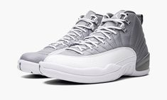 The Air Jordan 12 “Stealth” is a versatile, two-tone grey-and-white colorway of the retro basketball shoe.  Originally released in 1997, the Jordan 12 was worn by Michael Jordan with the Chicago Bulls during the ‘96-97 NBA season, and in the ‘97 NBA Playoffs.  Here, the “Stealth” honors the shoe’s 25th anniversary, and it doesn’t disappoint.  Details include a Stealth Grey tumbled leather upper paired with a white pebbled mudguard.  The color block is reminiscent of the Jordan 12’s “Obsidian” co Jordan 12 Stealth, Pernell Whitaker, Hard Shoes, Tenis Jordan, Jordan 12s, Grey Jordans, All Jordans, Retro Basketball Shoes, Retro Basketball