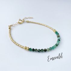 This beautiful emerald gemstone bracelet is handcrafted with 4mm natural emerald beads. The gold beading is done with high quality Japanese Miyuki Duracoat delica seed beads. The larger round gold beads are 14k gold filled for lasting quality. A 14k gold filled spring clasp completes the look. It's the perfect bracelet for layering or wearing all on its own! It's simple, yet elegant design makes it a great option for every day wear. This bracelet can be purchased in either 14k gold filled or ste Gold Jade Jewelry With Faceted Beads, Gold Jade Beaded Bracelets With Gemstones, Dainty Green Gemstone Beaded Bracelets, May Birthstone Faceted Beads Bracelet, Gold Rondelle Beaded Bracelets With Natural Stones, Faceted Round Bead Bracelets For May Birthstone, Gold Beaded Gemstone Bracelets For Jewelry Making, Gemstone Beaded Bracelets For Jewelry Making, Handmade Gold Jade Beaded Bracelets