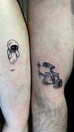 two people with tattoos on their legs, one has an astronaut and the other has a rocket ship