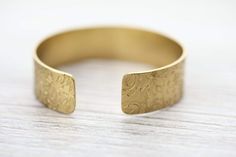 Bracelets Lotus Cuff Bracelet Bohemian Stamped Bracelets For Wedding, Bohemian Stamped Bracelet For Wedding, Etched Cuff Jewelry As A Gift, Etched Brass Bracelets For Gifts, Adjustable Etched Cuff Jewelry, Elegant Etched Brass Bracelets, Adjustable Etched Brass Bracelets, Brass Bracelets With Intricate Design, Antique Brass Cuff Bracelet Gift