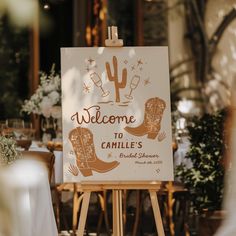 a welcome sign is displayed on an easel