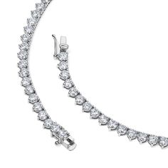 The classic diamond tennis necklace with a three-prong setting is an elegant piece of jewelry. The three-prong setting secures each diamond in place while allowing maximum light to pass through, enhancing the brilliance and sparkle of the diamonds. Available in 14K Yellow Gold and White Gold Diamond quality = GH-Color, SI-Clarity 3 prong setting Necklace length options: 15in = 17.50 carats 16in = 18.97 carats Classic Diamond White Tennis Necklace With Prong Setting, Dazzling Tennis Necklace With Prong Setting, Classic Diamond Cut Tennis Necklace In Diamond White, Classic Tennis Necklace In Diamond White With Brilliant Cut, Classic Diamond White Tennis Necklace With Diamond Cut, Classic Tennis Necklace In Diamond White Cubic Zirconia, Timeless Diamond White Tennis Necklace With Prong Setting, Classic Diamond White Tennis Necklace With Brilliant Cut, Classic Tennis Necklace In White Gold With Brilliant Cut