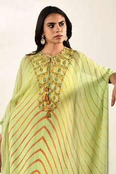 Green kaftan with chevron print and thread embroidered placket. Paired with inner.
Components: 2
Pattern: Printed, Embroidery
Type Of Work: Chevron, thread
Neckline: Keyhole
Sleeve Type: Kaftan sleeves
Fabric: Georgette
Color: Green
Other Details: 
Front tassel tie-up
Occasion: Destination Wedding - Aza Fashions Anarkali Multicolor Kaftan With Dabka Work, Bollywood Style Embellished Green Kaftan, Green Resham Embroidered Kaftan In Georgette, Embroidered Anarkali Georgette Kaftan, Embroidered Anarkali Style Georgette Kaftan, Festive Dabka Embroidered Georgette Kaftan, Festive Multicolor Kaftan With Zari Work, Green Tunic Kaftan For Festive Occasions, Green Embellished Kaftan For Festivals