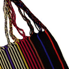 These versatile totes are handwoven by artisans in Chiapas, Mexico on a backstrap loom. Perfect for a beach day, the farmer's market, or as an everyday purse! This bag is approx. 16" wide x 26" tall with the strap. Due to the handmade nature, height and width of bag can vary up to 10%. Artisan Black Handwoven Shoulder Bag, Traditional Black Rectangular Crochet Bag, Traditional Black Beach Bag, Traditional Black Woven Crochet Bag, Traditional Black Crochet Woven Bag, Eco-friendly Handwoven Black Crochet Bag, Eco-friendly Black Handwoven Crochet Bag, Multicolor Fair Trade Beach Bag For Market, Black Woven Tote Bag