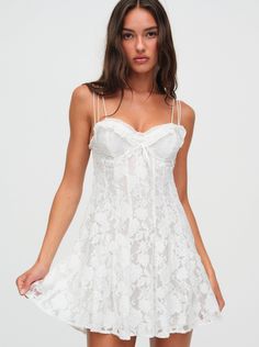 For a short dress that exudes elegance and femininity, look no further than the Kate white mini dresscrafted in dreamy embroidered organza. This little white dress features underwire cups, a pleated skirt, and a seductive low-cut open back. White Mini Dress Aesthetic, Bridal Era, Mini White Dress, Lacey Dress, White Slip Dress, Little White Dress, Embroidered Organza, Mini Slip, Lemon Dress