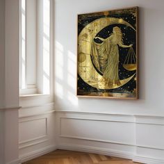 a painting hanging on the wall in an empty room with wooden floors and white walls