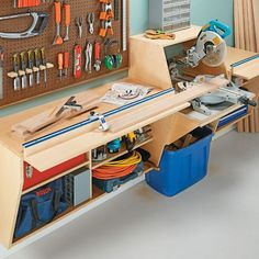 a workbench with tools on the wall