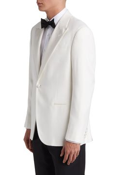 Evoke old-school glamour in a white Italian-made dinner jacket designed with classic satin peaked lapels. 30" length (size 52 EU) One-button closure Peaked lapels Four-button cuffs Front welt pockets Side vents Lined 100% viscose Dry clean Made in Italy Wedding Outerwear With Single Button And Notch Lapel, Classic Tailored Blazer For Wedding, Classic Single Button Tuxedo For Semi-formal Occasions, Classic Single Breasted Tuxedo For Wedding, Classic Tailored Wedding Blazer, Wedding Tuxedo Blazer With Double Button Closure, Classic White Evening Suit, Wedding Tuxedo Blazer With Double Button, Classic Wedding Tuxedo Single Breasted