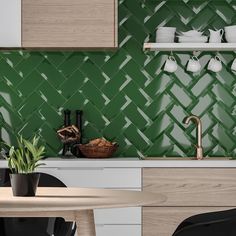 a kitchen with green tiles on the wall