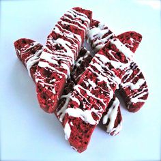 red velvet cake slices with white icing on a blue plate, ready to be eaten