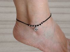 Nylon cord and sterling silver om symbol anklet bracelet.  All components are 925 sterling silver. Available sizes: 8.30" + 2" extension chain (21 cm + 5 cm) 8.70" + 2" extension chain (22 cm + 5 cm) 9.10" + 2" extension chain (23 cm + 5 cm) Shipping: By Postal Service (no tracking). If you need tracking please choose another shipping option when you order it. You can see other models  https://www.etsy.com/es/shop/Malukart Casual Silver Anklets For Gifting, Casual Silver Anklets As Gift, Casual Silver Anklets For Gifts, Sterling Silver Anklets For Summer Gifting, Sterling Silver Anklets For Summer, Dainty Adjustable Sterling Silver Anklets, Silver Spiritual Anklets As Gift, Silver Casual Anklets For Festival, Casual Silver Anklets For Festival