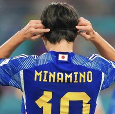 the back of a soccer player's head with his hands on his head,