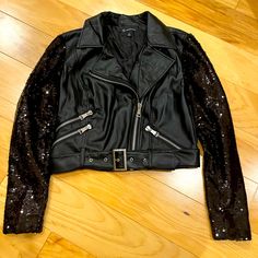 New, Never Worn Inc Vegan Leather Moto Jacket, Size M. Regular Fit. Notch Collar, Front Zipper Closure, Sequin Sleeves. Machine Washable. Black Sequined Outerwear For Fall, Trendy Black Outerwear With Sequins, Trendy Black Sequined Outerwear, Edgy Leather Jacket With Metal Zipper, Fitted Long Sleeve Embellished Leather Jacket, Black Leather Jacket With Rhinestone Rivets, Fitted Black Embellished Leather Jacket, Fitted Embroidered Long-sleeved Leather Jacket, Crop Jean Jacket